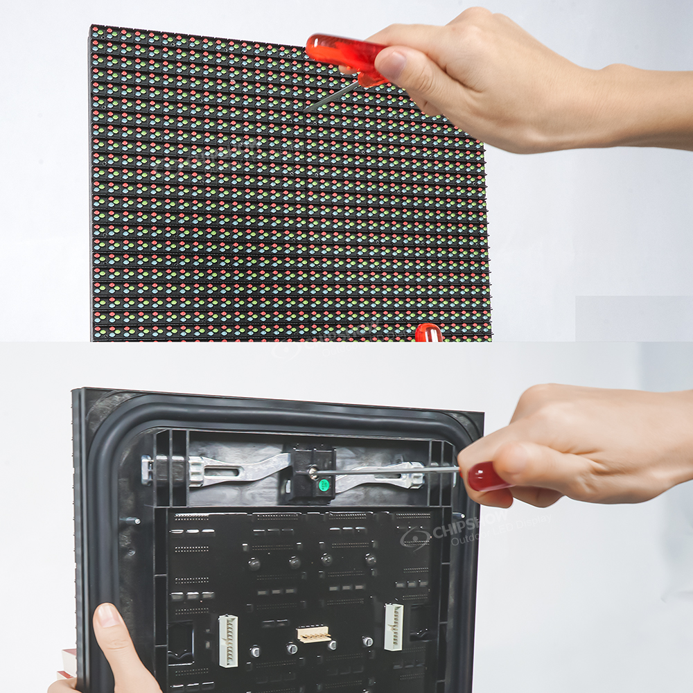 Hands removing an outdoor LED module with a screwdriver, showing the pixel grid on the front and the driver board on the back