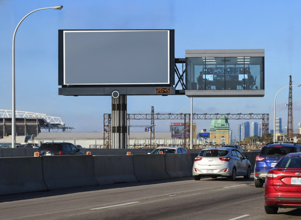 A highway variable message sign beside a secure control room with network boundary overlays