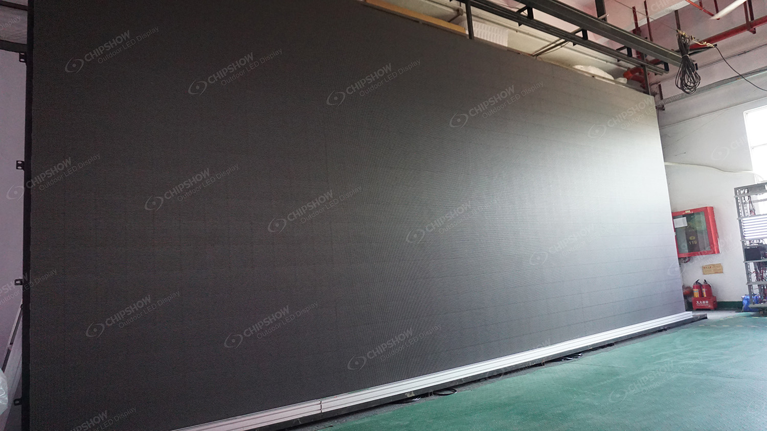 Large LED wall under factory aging test used to evaluate brightness, color uniformity, grayscale and dead-pixel performance.