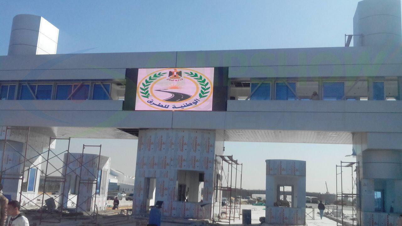 Highway LED sign mounted over an overpass in Egypt