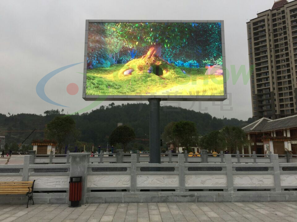 Double-sided roadside LED display in a public square in Guizhou