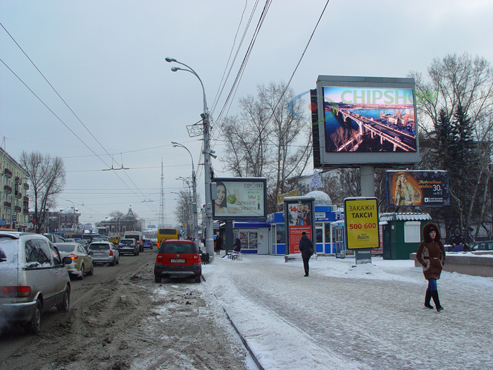 Roadside digital billboard in snowy winter conditions