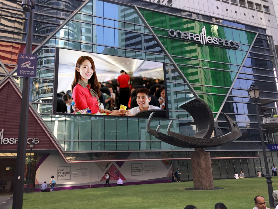 Outdoor LED advertising screen mounted on a commercial building in an urban setting.